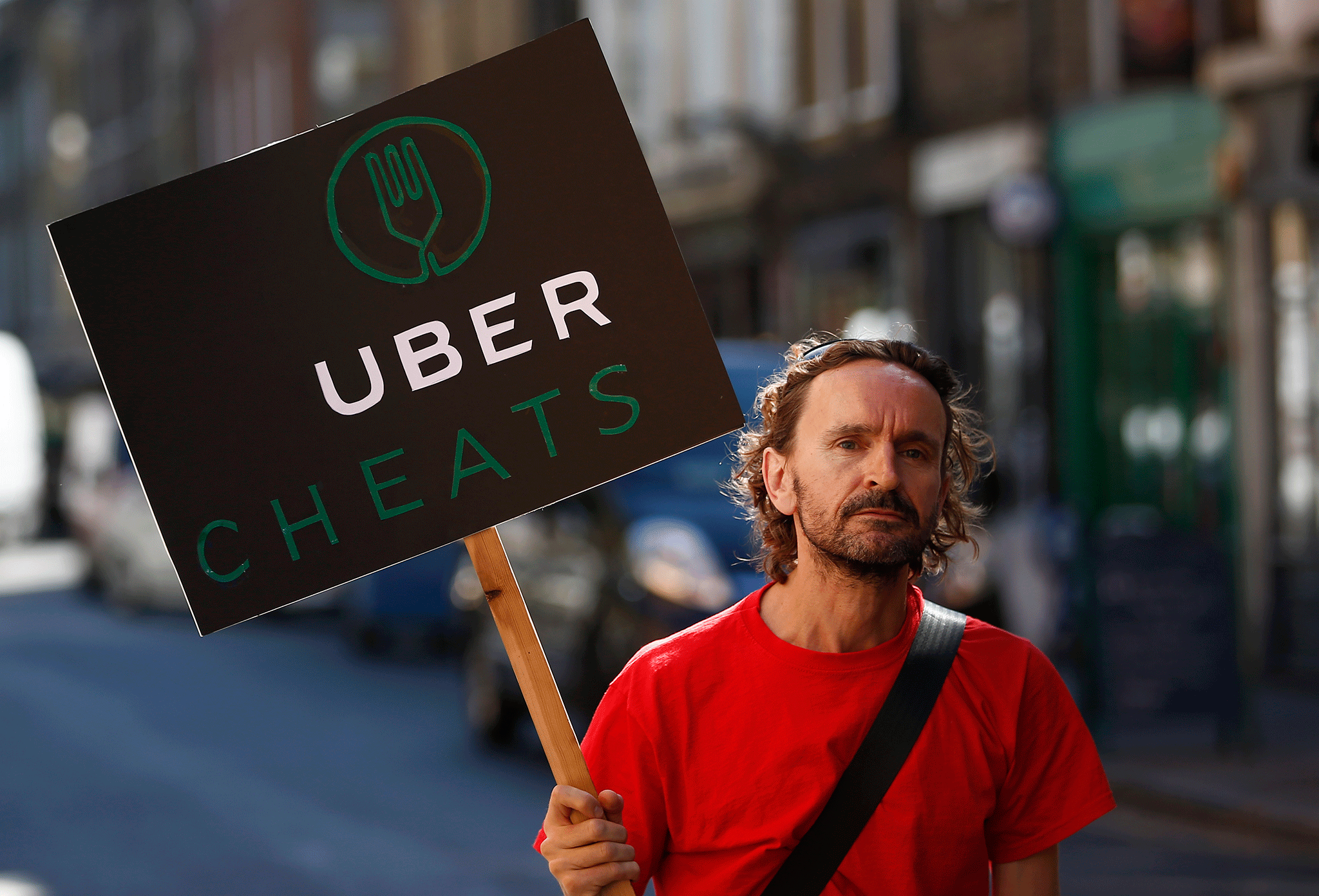 a protest by UberEATS workers protest over pay and conditions, outside the company's offices in London, August, 2016