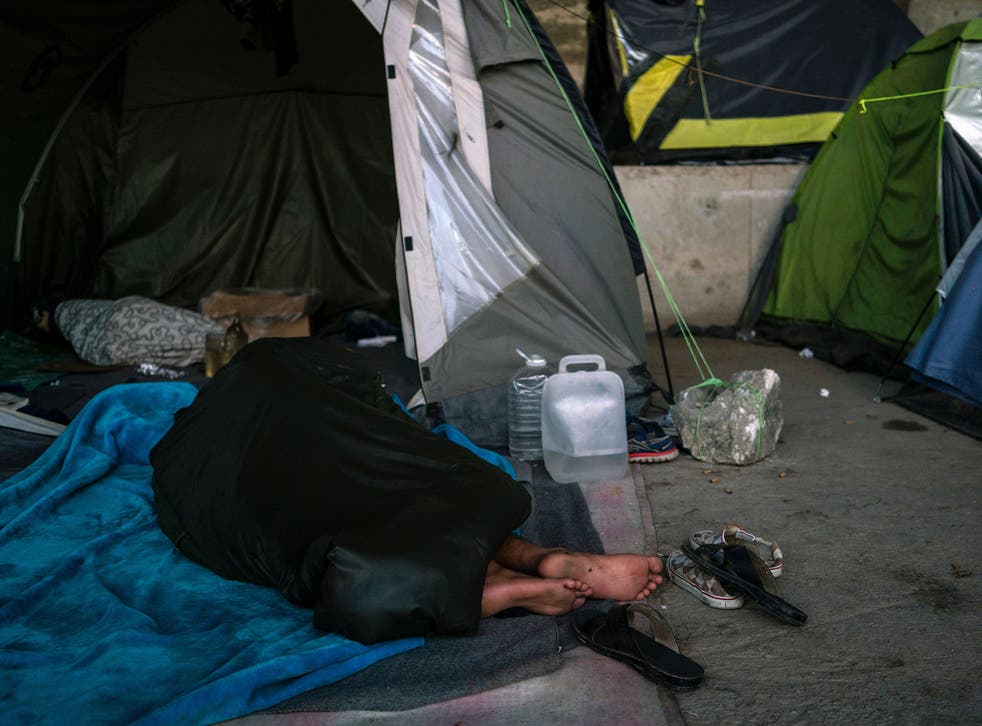 More than 1,500 migrants are living around the Greek port of Piraeus