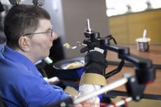 Paralysed man moves arm using brain implant that can read his mind