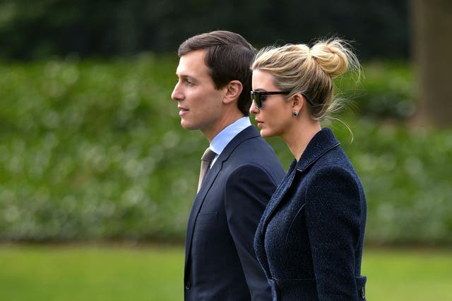 Jared Kushner, senior adviser to President Trump, walks with his wife, Ivanka