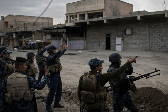 Federal Police soldiers fight against Isis in west Mosul