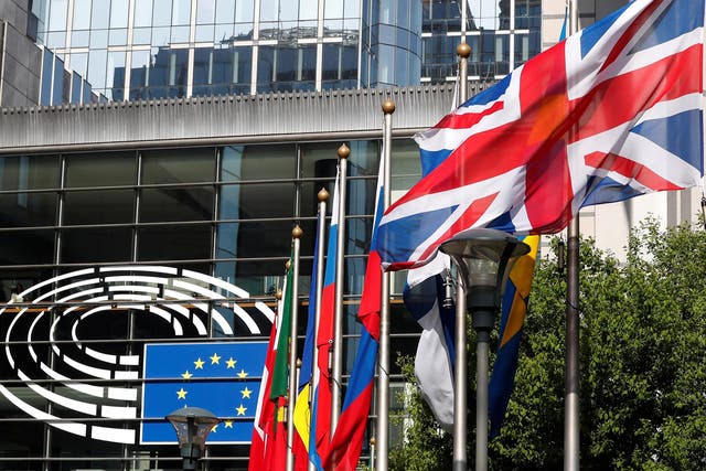 A Union Jack flies outside the entrance of the European Parliament in Brussels