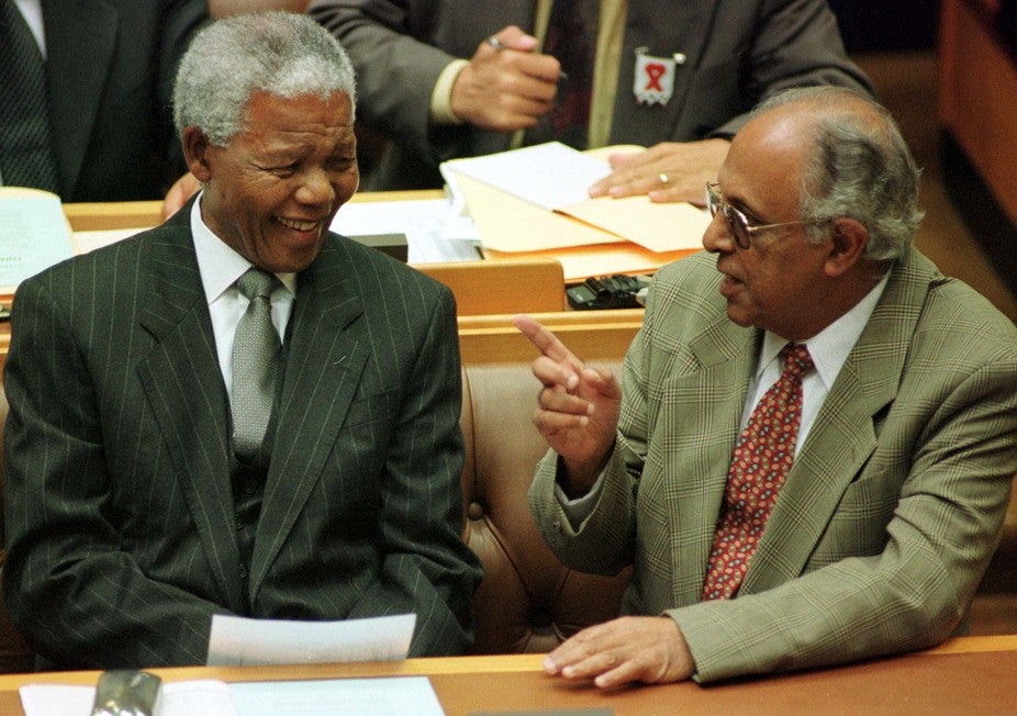 Nelson Mandela and Ahmed Kathrada share a moment in South Africa’s Parliament in 1999