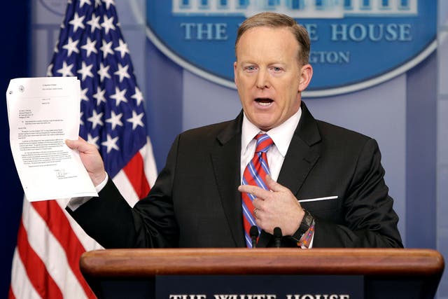 White House Press Secretary Sean Spicer holds a letter pertaining to Acting Attorney General Sally Yates's ability to testify to a Congressional investigation into Russian links with the Trump campaign during his daily press briefing on March 28 2017