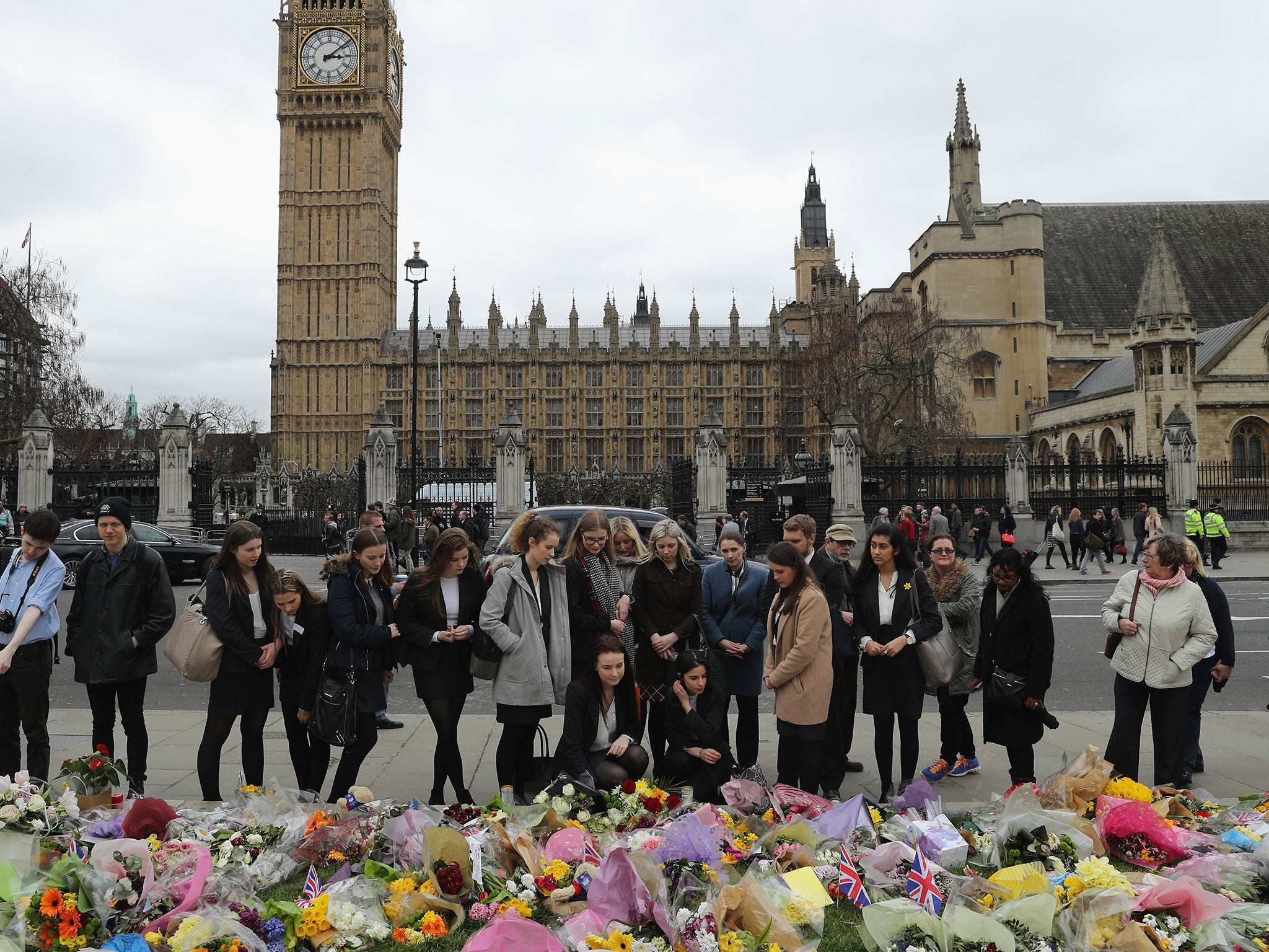 People look at floral tributes left for the victims of the Westminster terrorist attack (file photo)