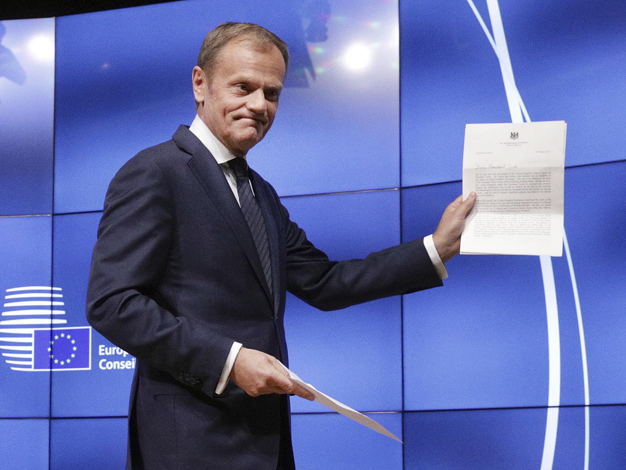 Donald Tusk showing the letter he received signed by Prime Minister Theresa May, which formally notified of the UK's intention to exit the EU