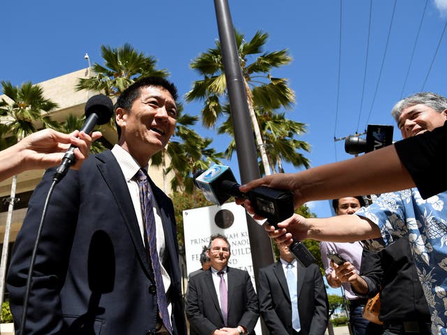 Hawaii Attorney General Douglas Chin talks to the media at the US District Court Ninth Circuit in Honolulu after winning an extension to his lawsuit against President Donald Trump's new travel ban