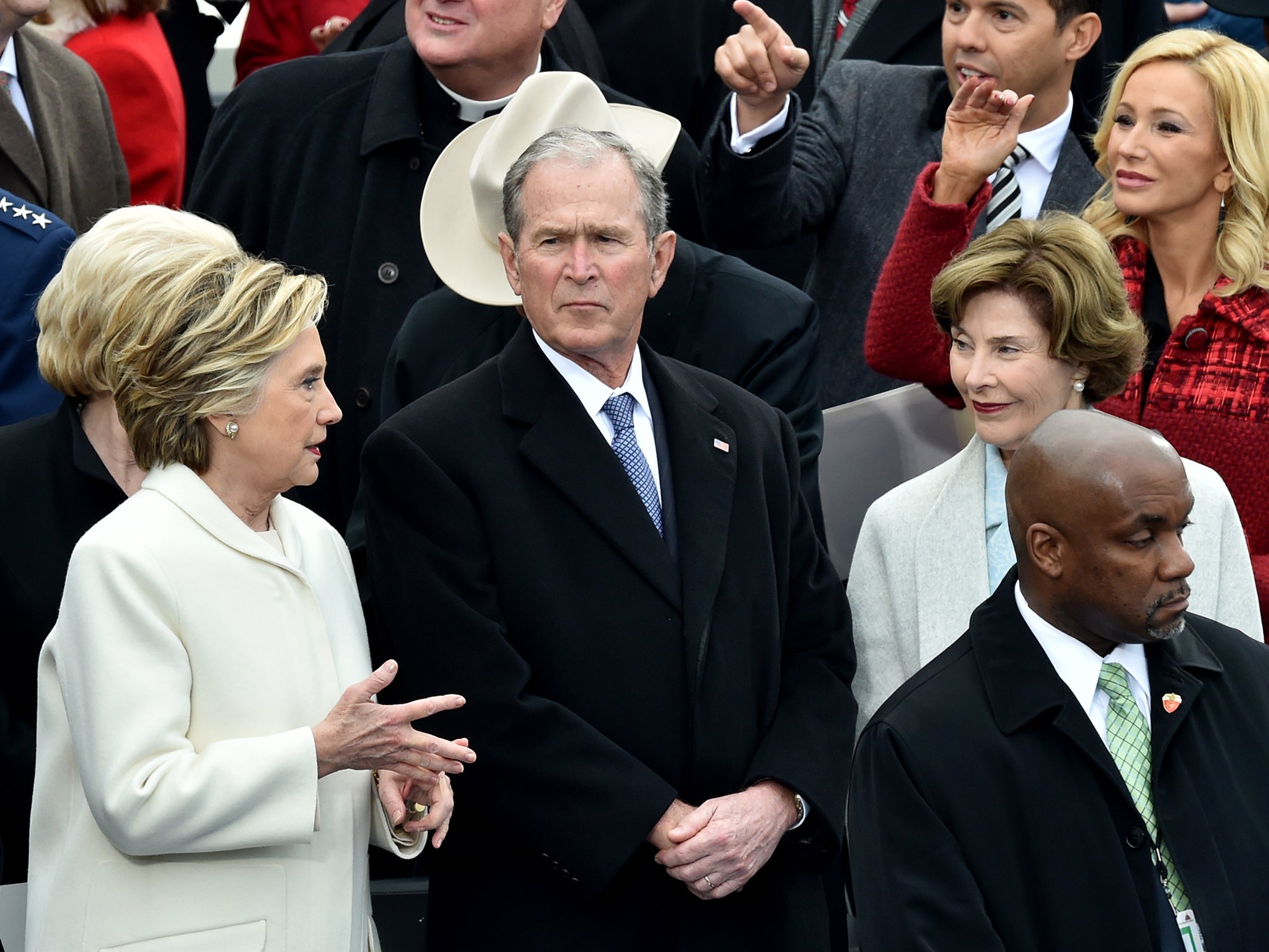 George W Bush with Hillary Clinton and his wife Laura (L-R) at the inauguration in January