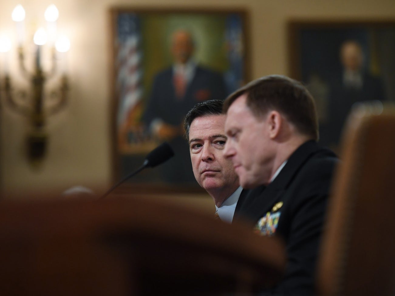 FBI Director James B. Comey, left, and National Security Agency Director Mike Rogers appear before the House Intelligence Committee on March 20