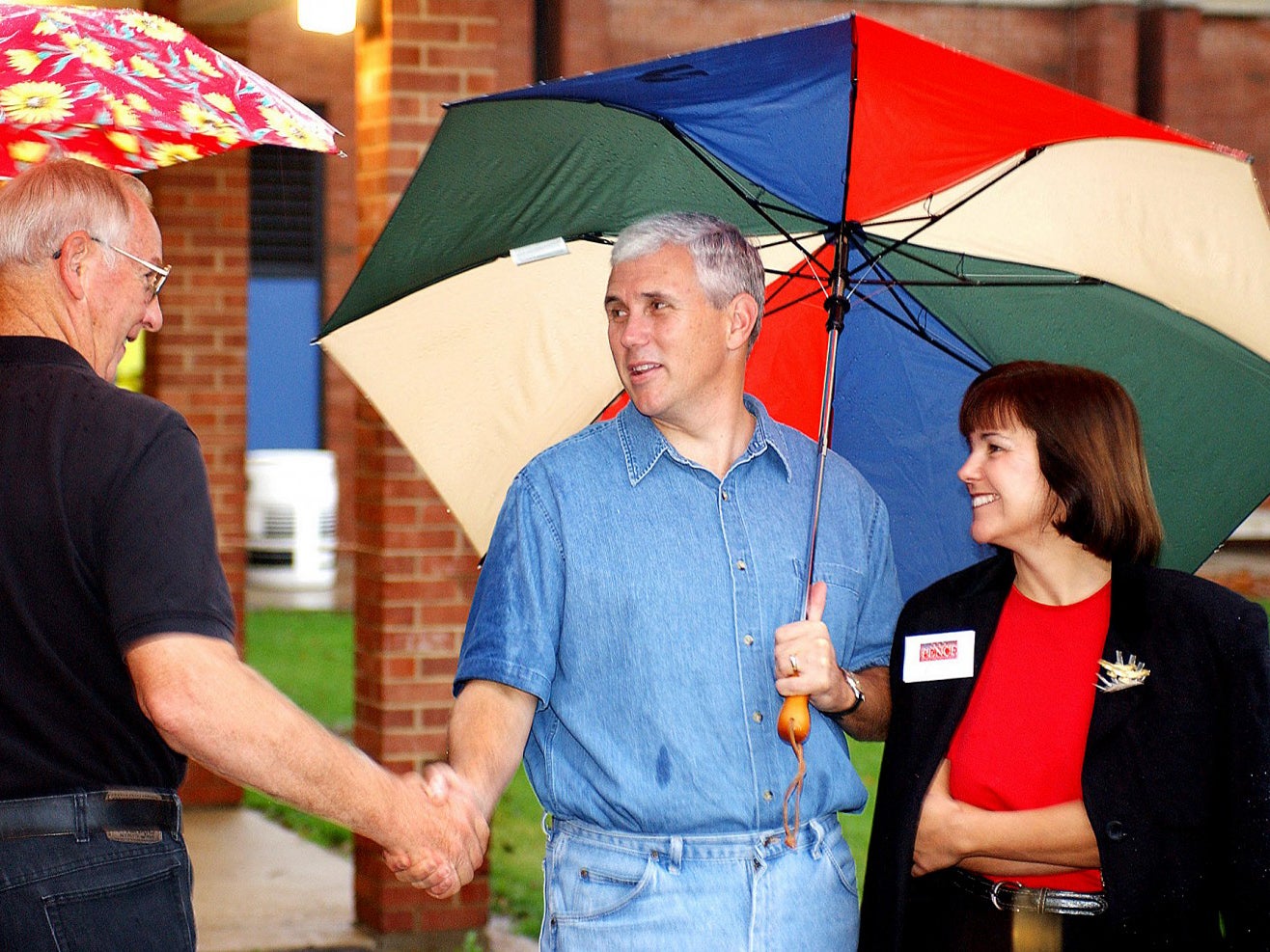 Mike Pence, centre, and Karen Pence campaign at Parkside Elementary School in Columbus, Indiana, in 2004