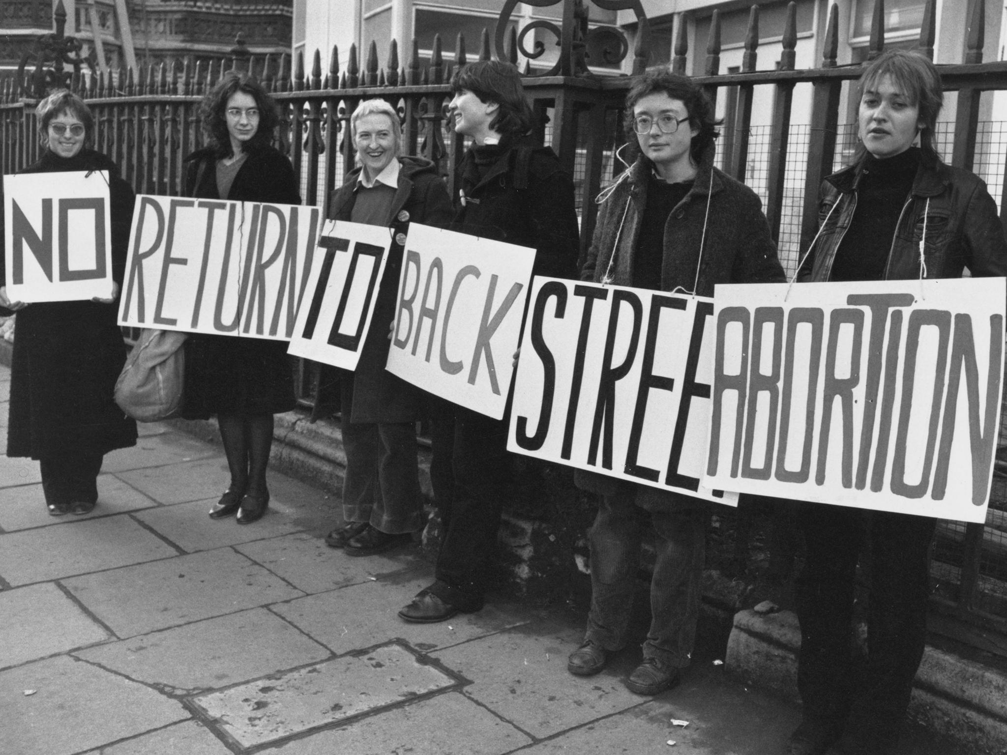 A group of women demonstrating in favour of legal abortions with a banner declaring 'No Return To Backstreet Abortions' circa 1980.