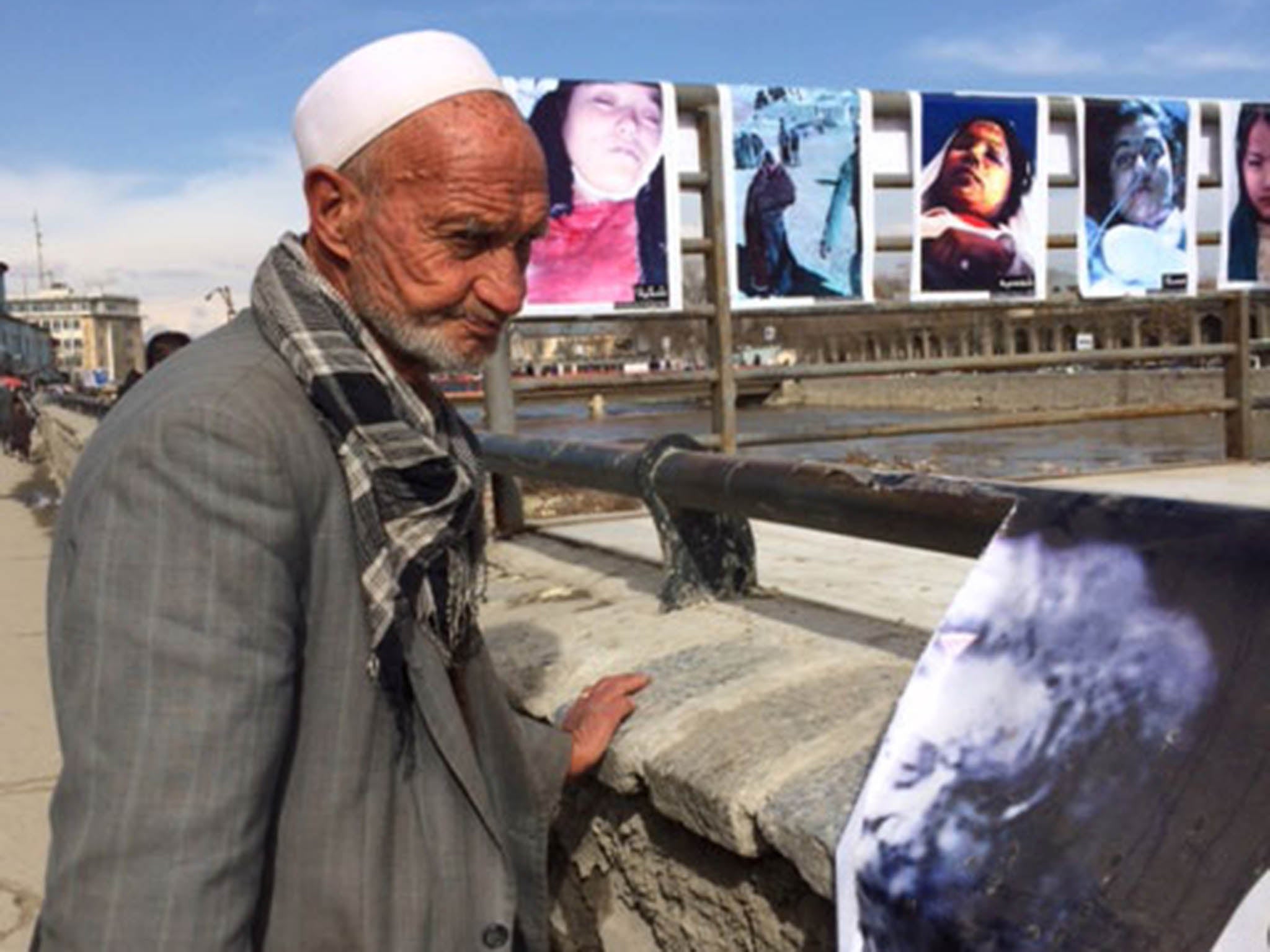 Photos of Farkhunda Malikzada, who was publicly beaten to death, are on display as a reminder of the brutal killing