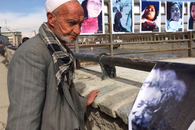 Photos of Farkhunda Malikzada, who was publicly beaten to death, are on display as a reminder of the brutal killing