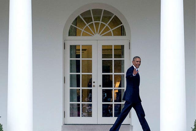 Barack Obama walks on the colonnade after leaving the Oval Office for the last time as President, in Washington, DC on January 20, 2017
