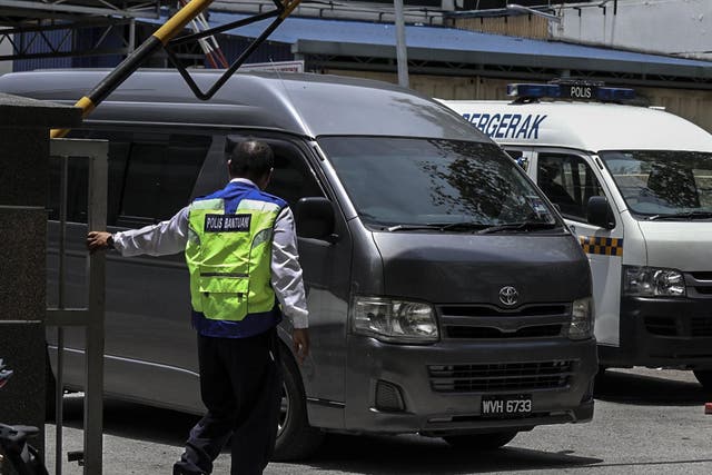 A van believed to be carrying the body of Kim Jong-un’s half brother was seen leaving a mortuary this morning