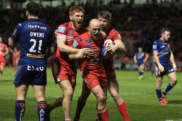 Skipper Michael Dobson celebrates one of his two tries