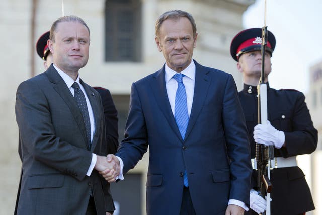 Joseph Muscat, left, currently holds the rotating presidency of the European Council 