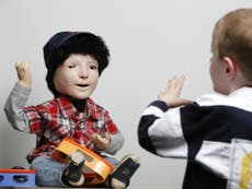 Humanoid robot with skin sensors to help children with autism