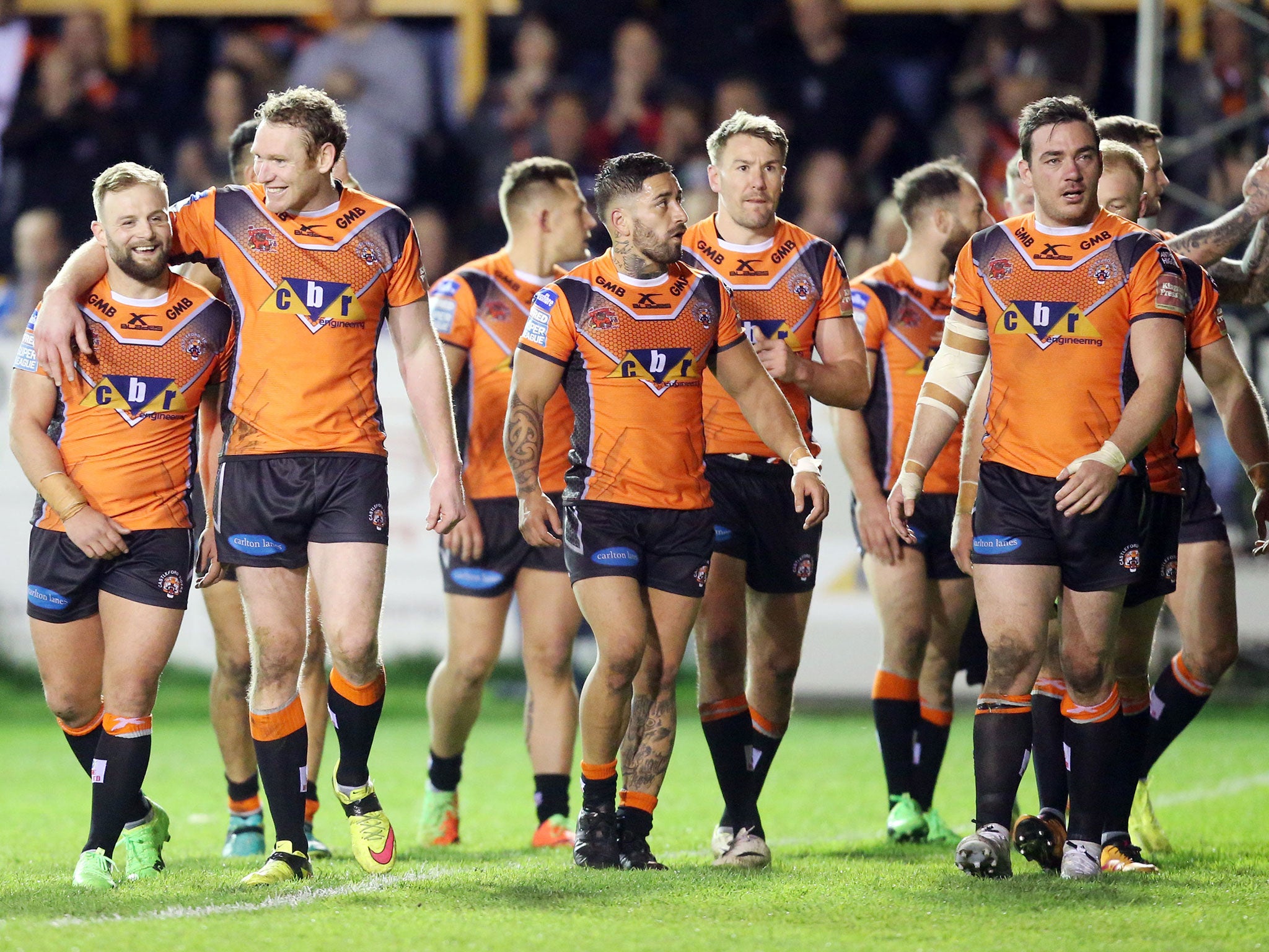 Castleford's players acknowledge their fans after the final whistle