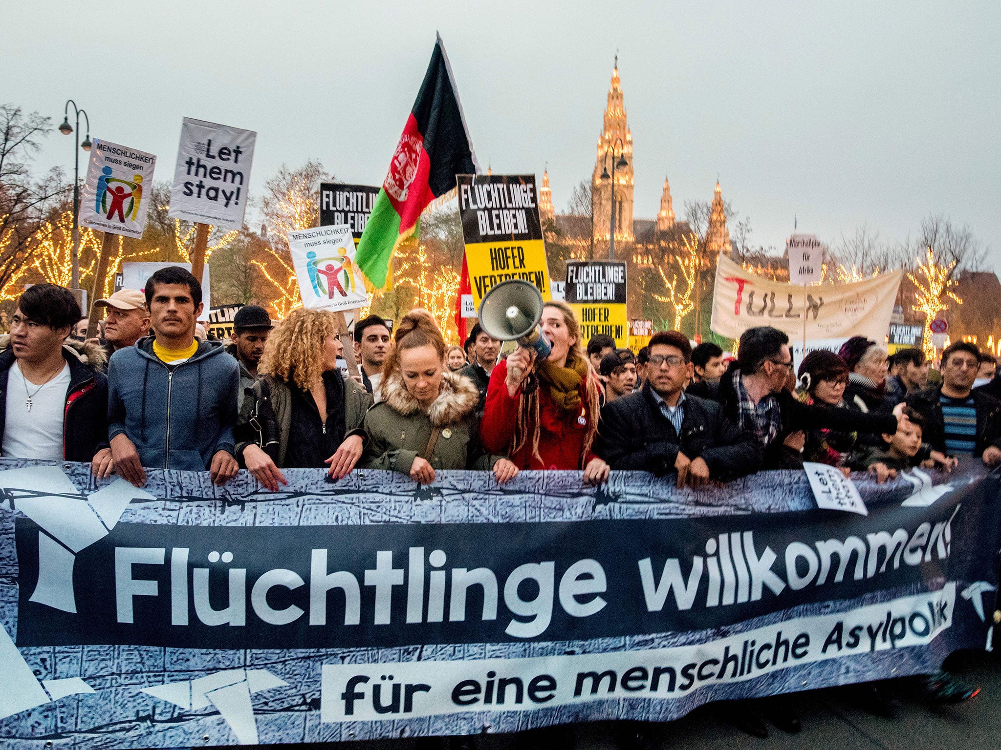 Austrian citizens and asylum seekers march during a pro-refugee protest called 'Let them stay' in Vienna, Austria on November 26, 2016.