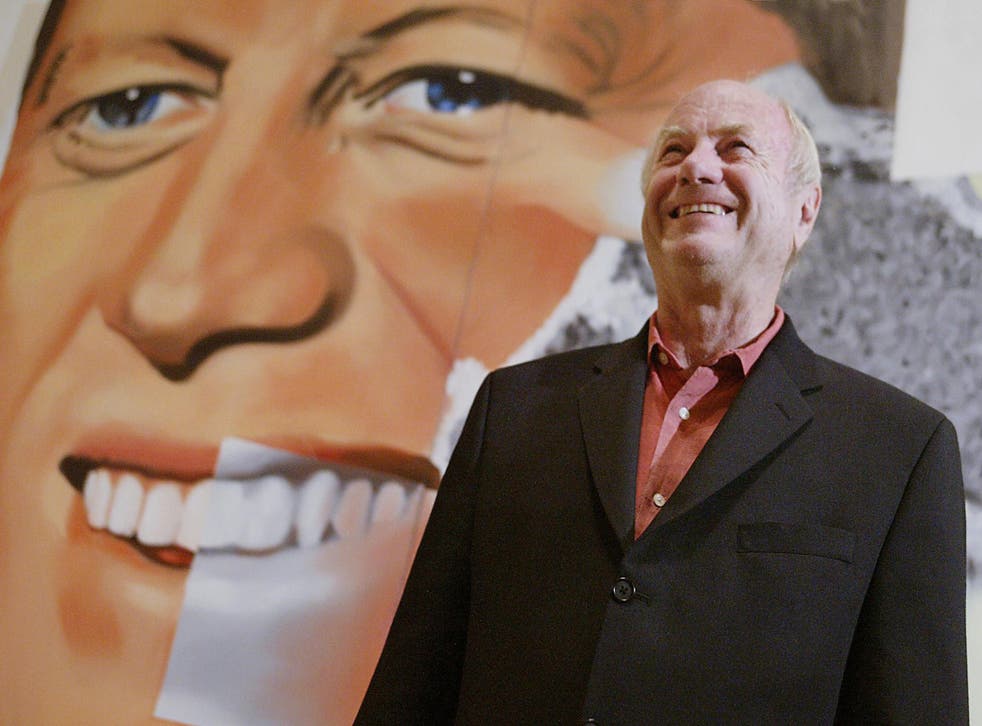 James Rosenquist stands in front of his painting "Elect President"