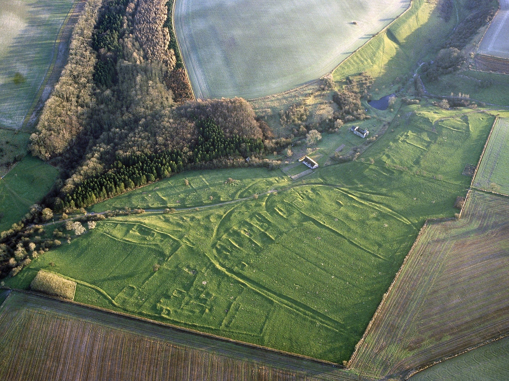 Aerial view of the abononed Yorkshire village of Wharram Percy, where bones have been excavated with evidence of post-death smashing with axes and burning