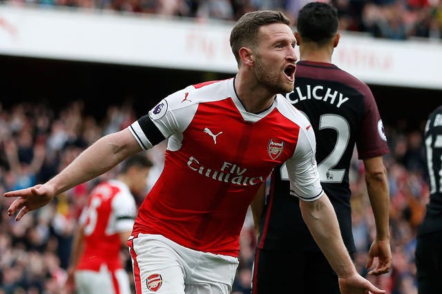 Arsenal's German defender Shkodran Mustafi celebrates after scoring their second goal during the English Premier League football match between Arsenal and Manchester City at The Emirates