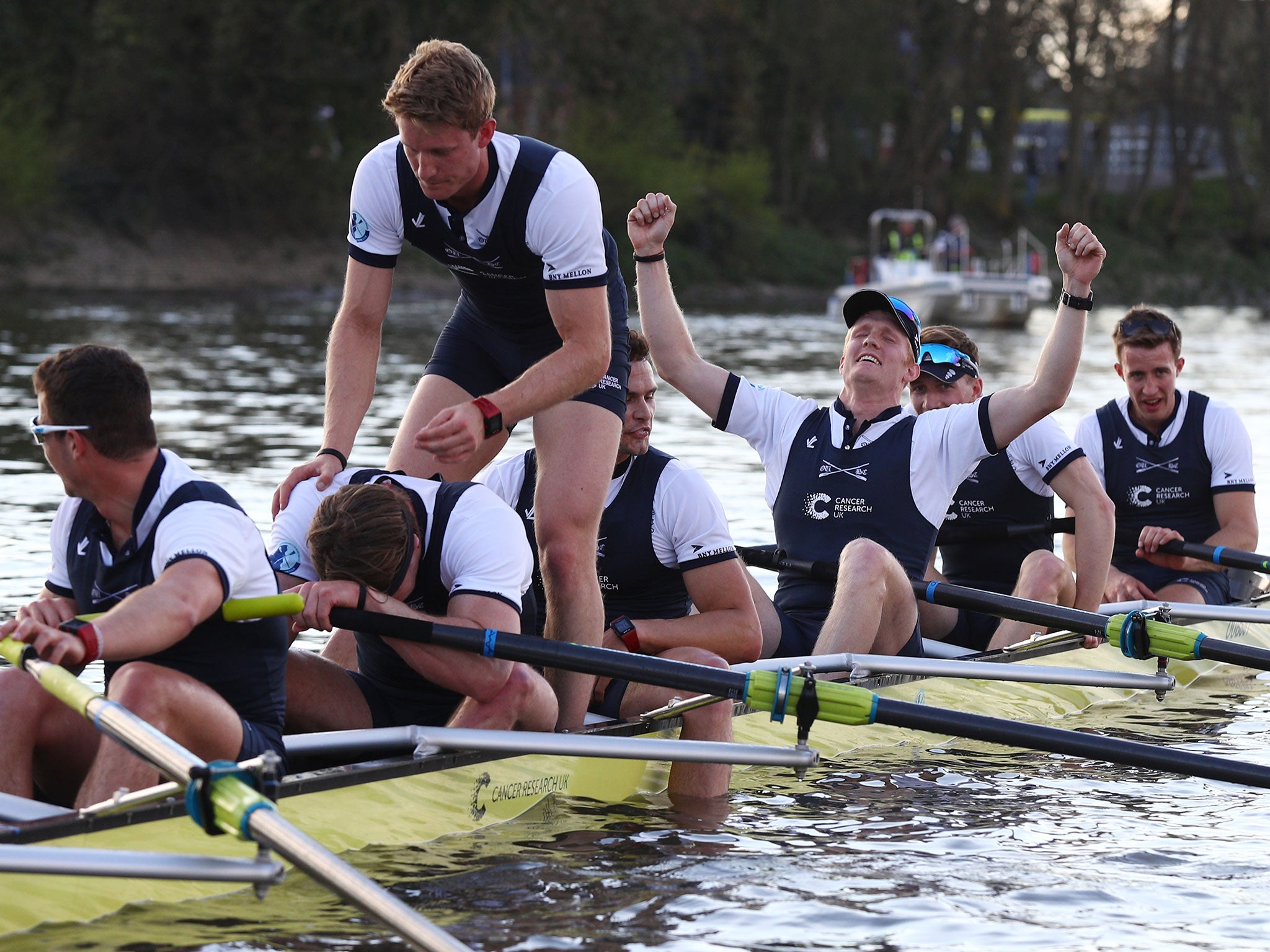Oxford's team celebrate after crossing the line