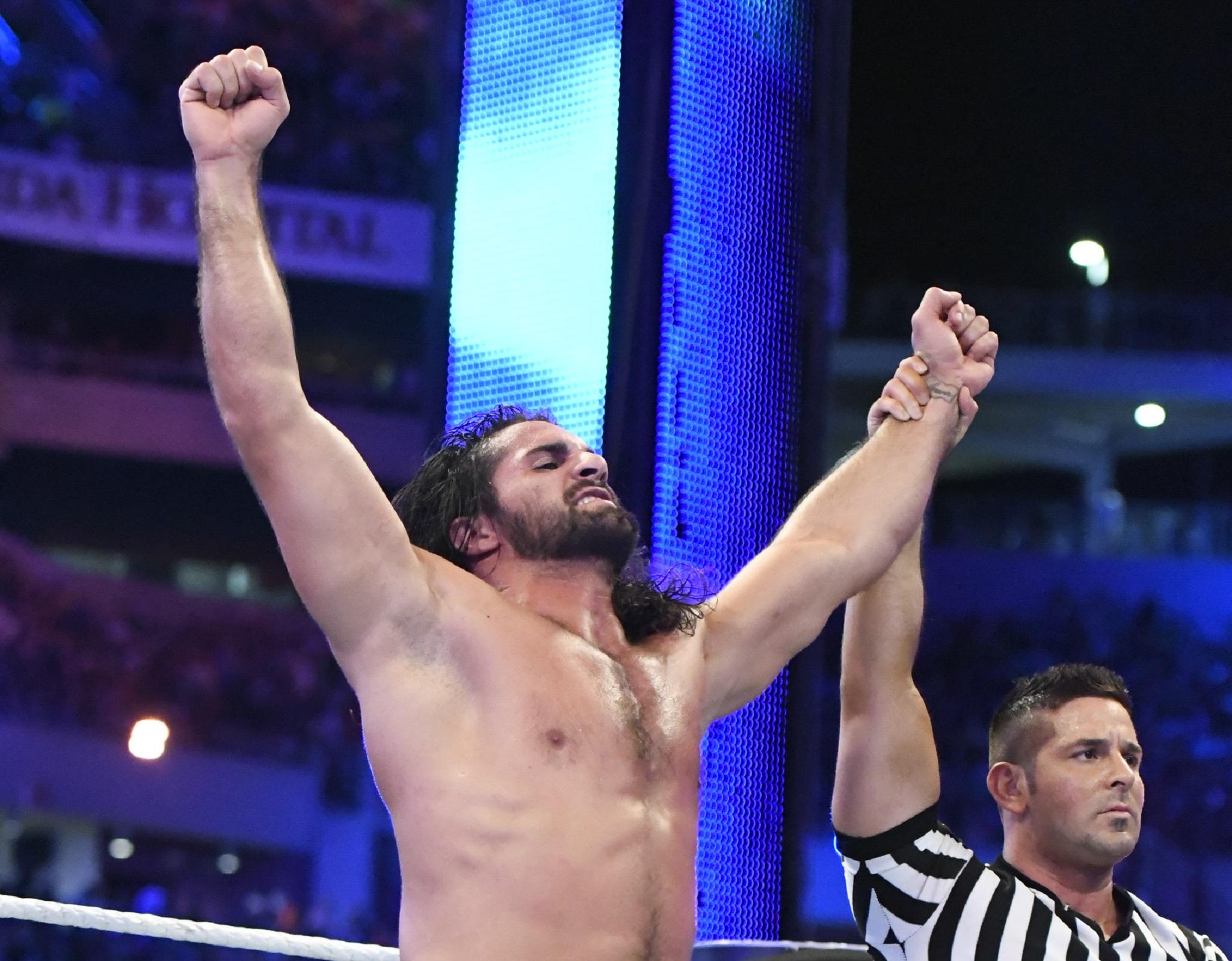 Seth Rollins celebrates his victory over Triple H