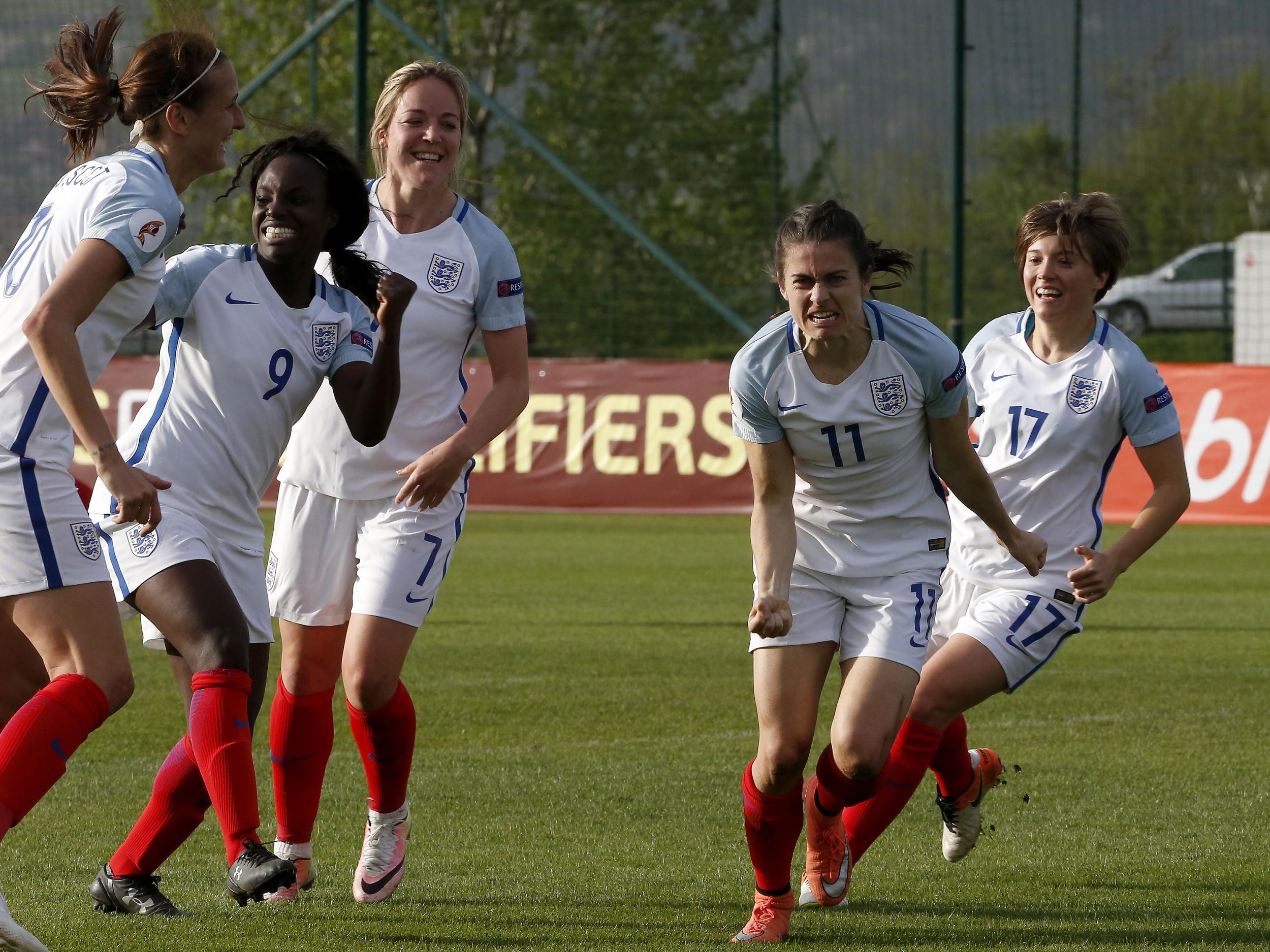 Karen Carney (C) of England celebrates scoring against the Bosnia and Herzegovina