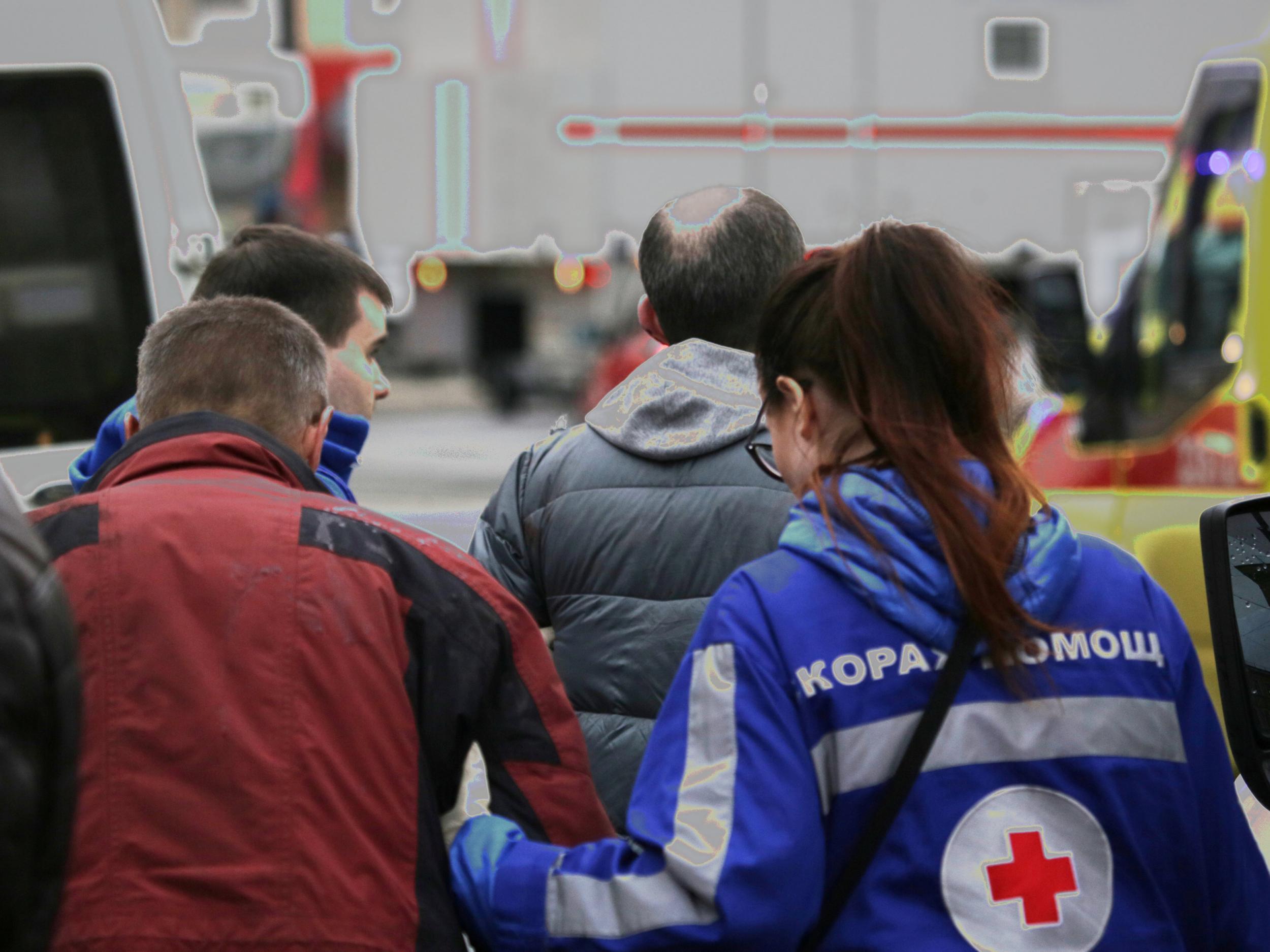 An injured person is helped by emergency services outside Sennaya Ploshchad metro station