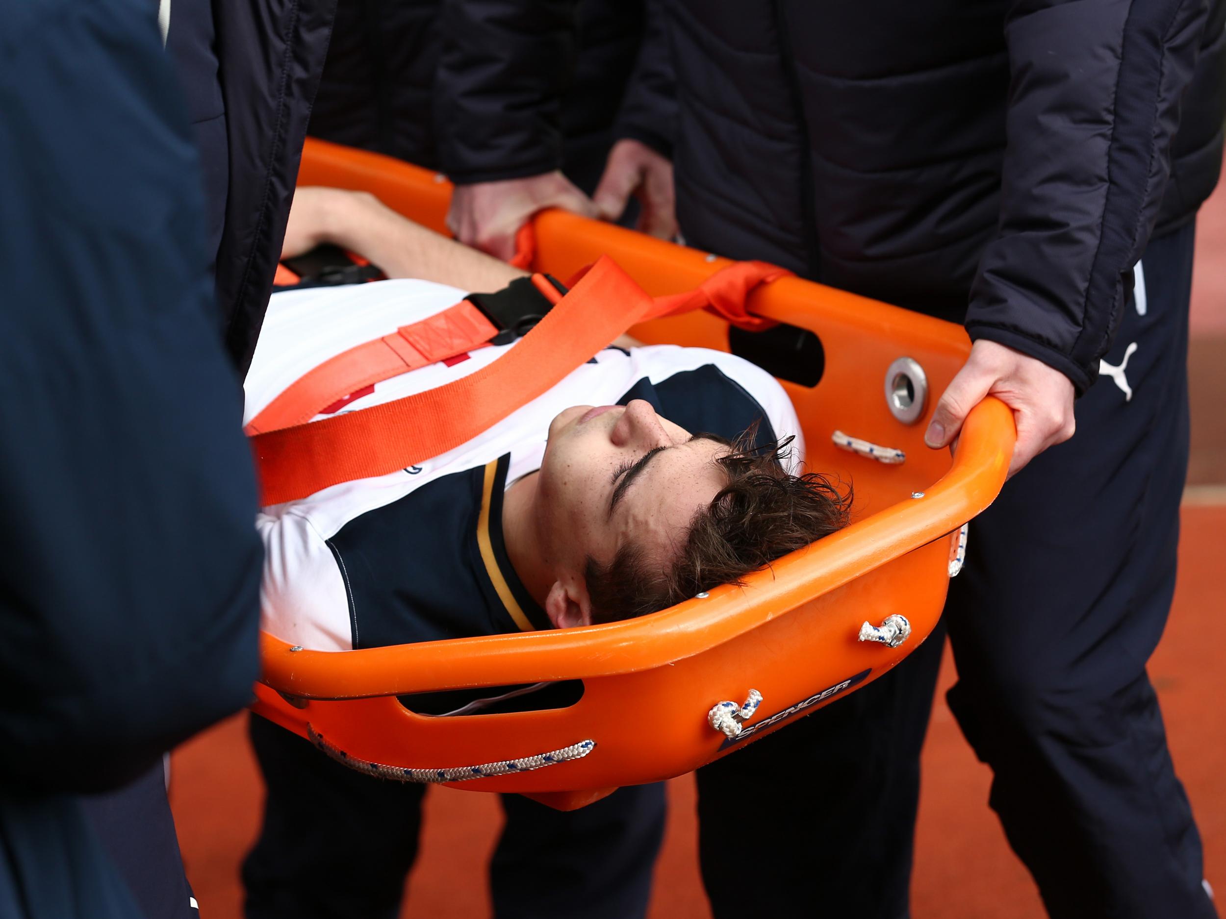 Winks was stretchered off during Tottenham's win over Burnley