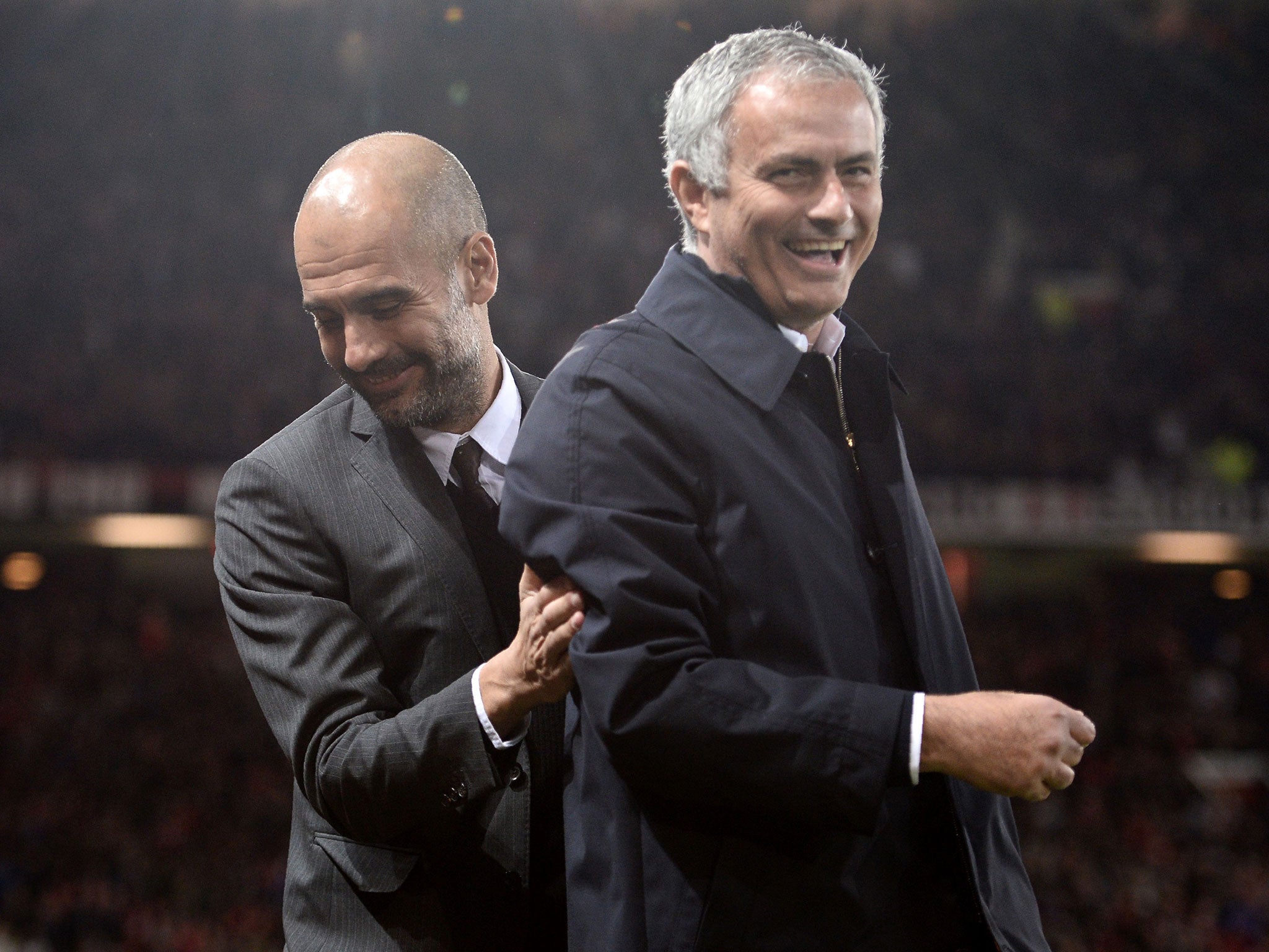 Guardiola and Mourinho share a joke before the fourth-round EFL Cup encounter between City and United last October