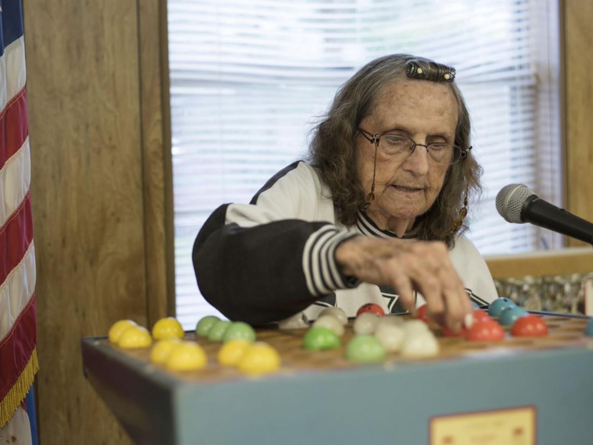 Maudie Anderson, 95, leads a bingo game at the senior centre