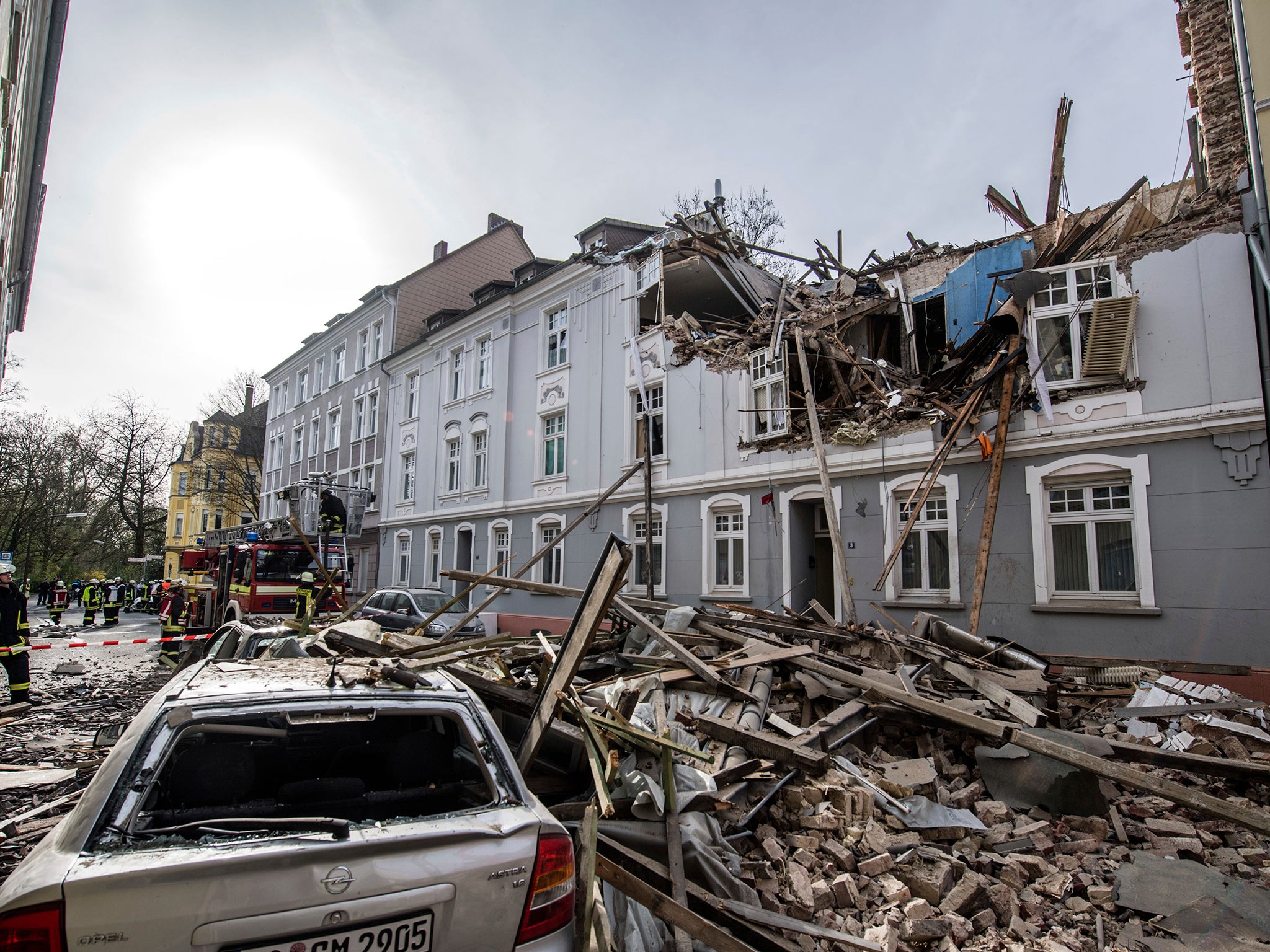 Debris sits on a street after an explosion in an apartment building in Dortmund