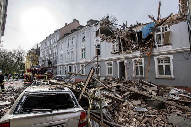 Debris sits on a street after an explosion in an apartment building in Dortmund
