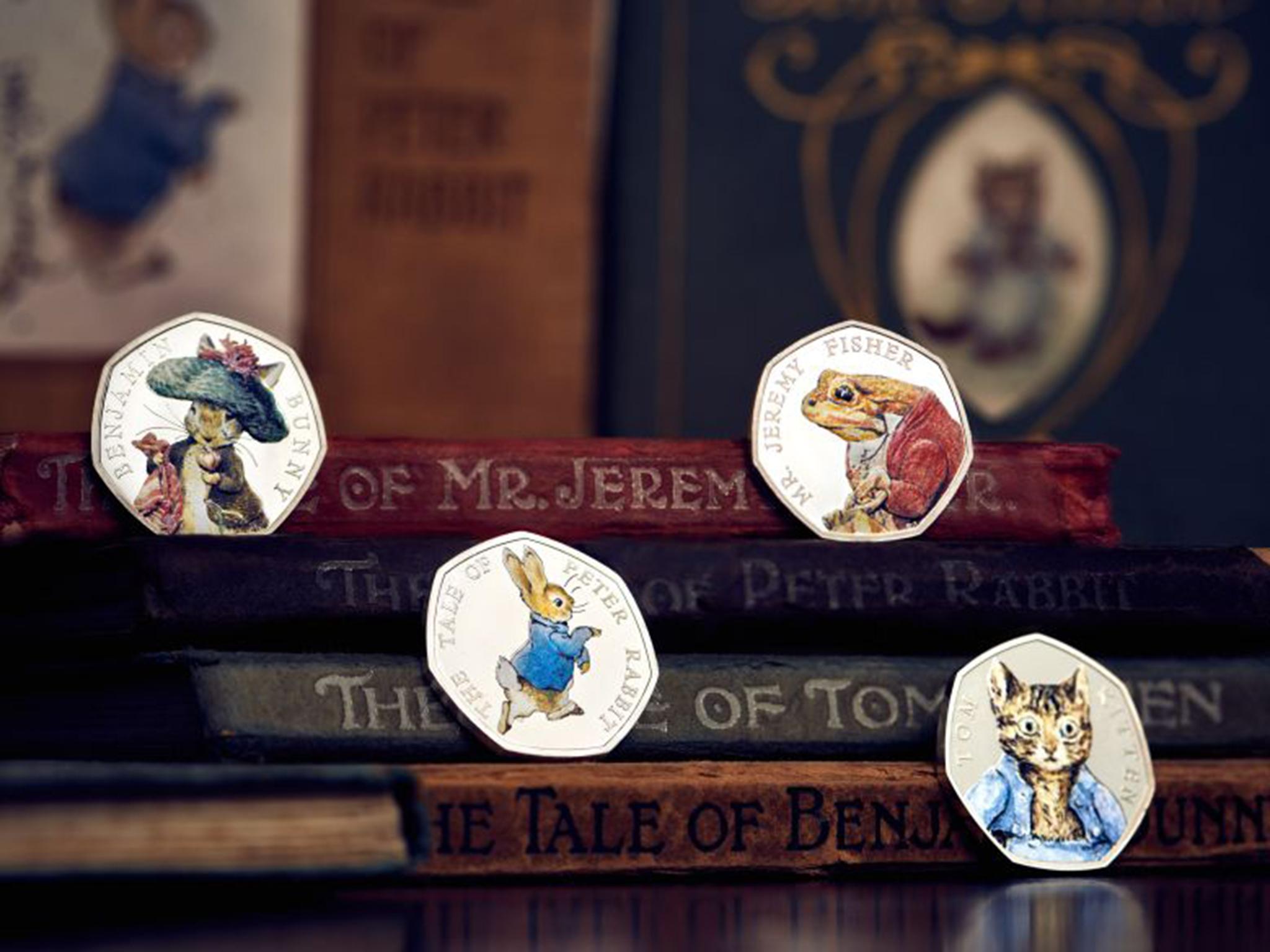 The coins feature four characters