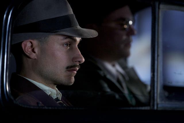 Gael Garcia Bernal as Oscar Peluchonnneau who is chasing after Pablo Neruda in the film 'Neruda'