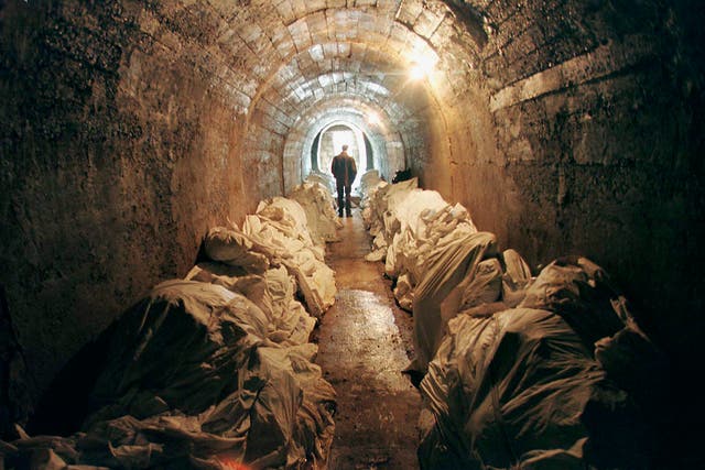 Stacks of unidentified corpses in an underground shelter in Tuzla, Bosnia, in 1997. The body bags contain victims found in mass graves and in wooded areas after the 1995 Srebrenica massacre