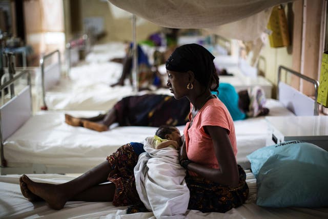 UNFPA (United Nation Population Fund) supports the local Ministry of Health with a program that promotes maternal health and family planning in Sierra Leone (MARCO LONGARI/AFP/Getty Images)