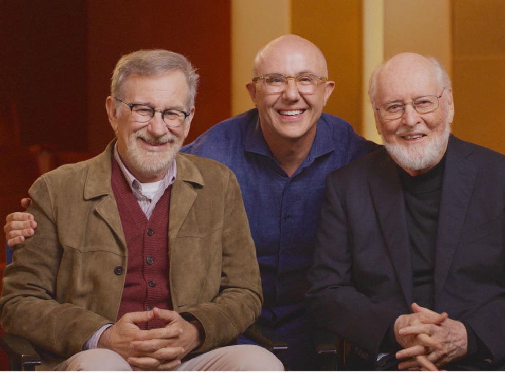 Among the stars: the documentary director (centre) with Steven Spielberg (left) and composer John Williams