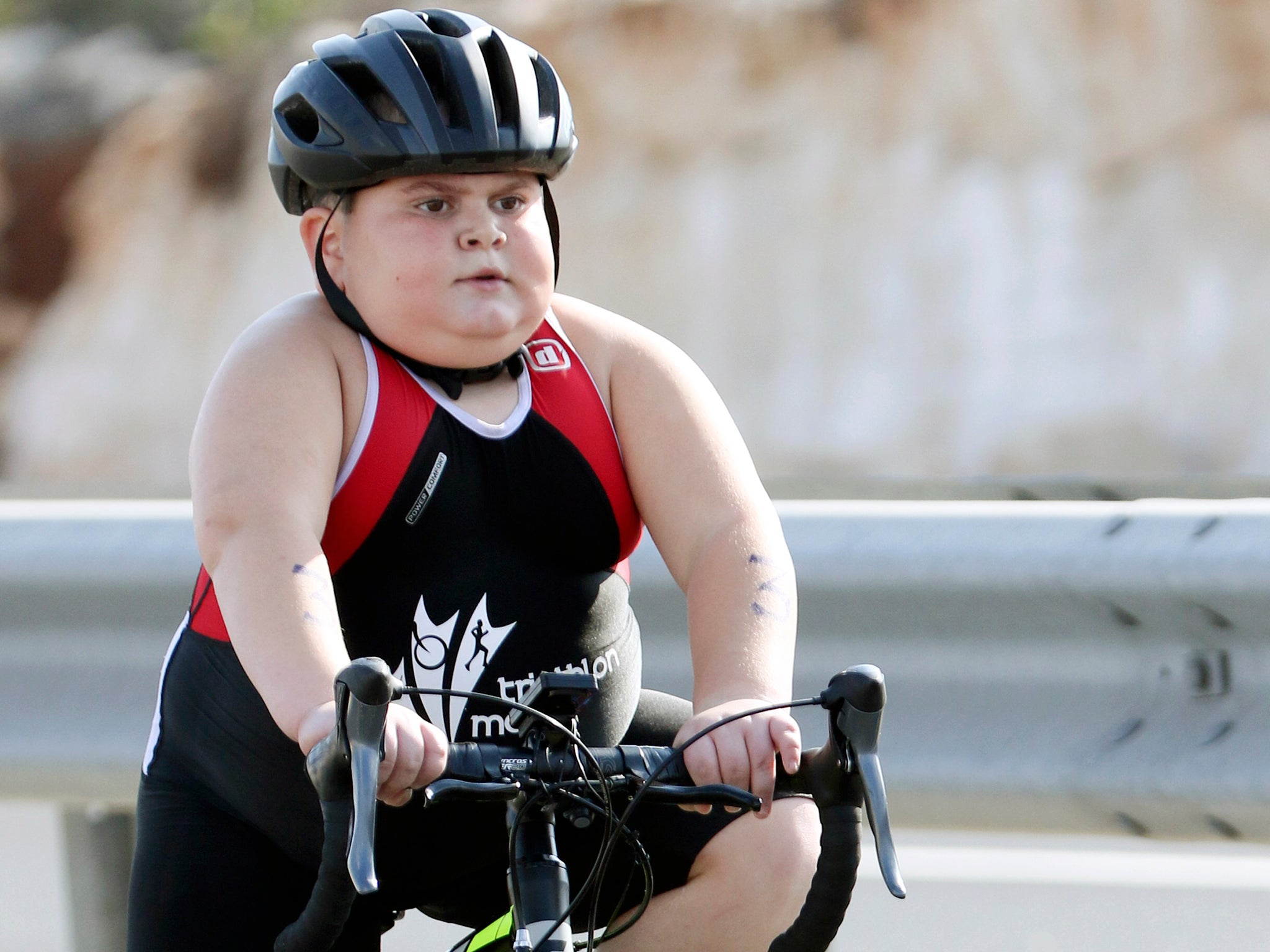 Jake Vella competing in the cycling section of a triathlon in Malta