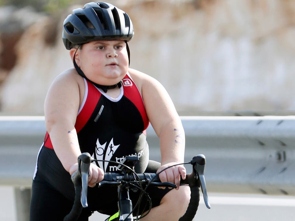 Seven-year-old boy competes in triathlons to fight rare ...