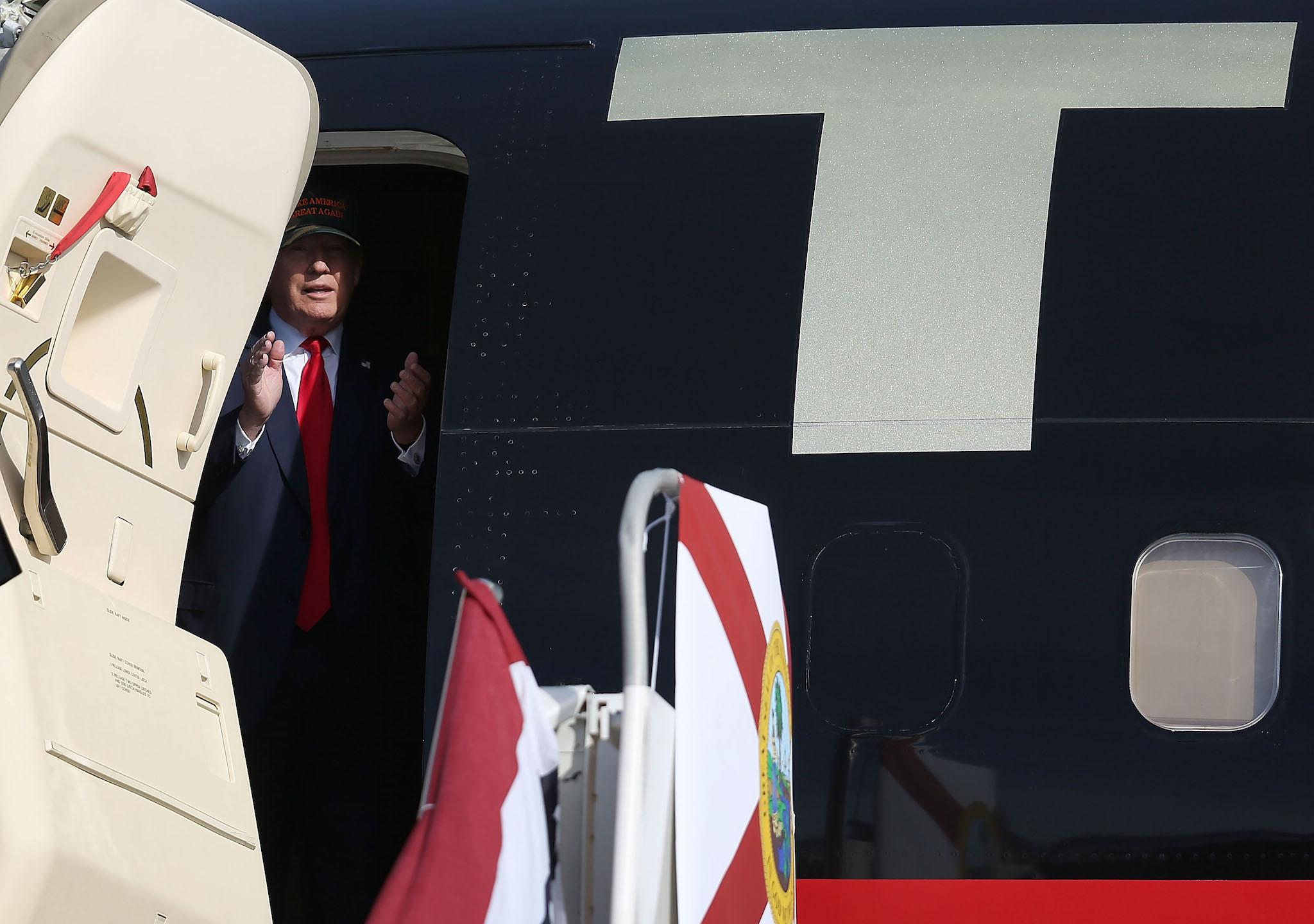 Republican presidential candidate Donald Trump waits to exit his campaign plane for a campaign rally at the Million Air Orlando, which is at Orlando Sanford International Airport on October 25, 2016 in Sanford, Florida