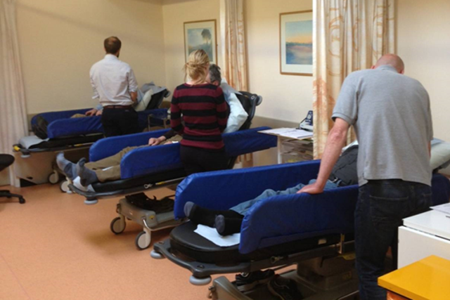 Two patients recovering after having had electroconvulsive therapy (ECT) and one person, who hasn't had ECT, receiving a ketamine infusion. The curtains have been drawn back but they would normally be closed.