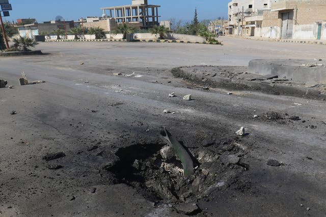 A crater is seen at the site of an air strike, after what rescue workers described as a suspected gas attack in the town of Khan Sheikhoun in rebel-held Idlib, Syria