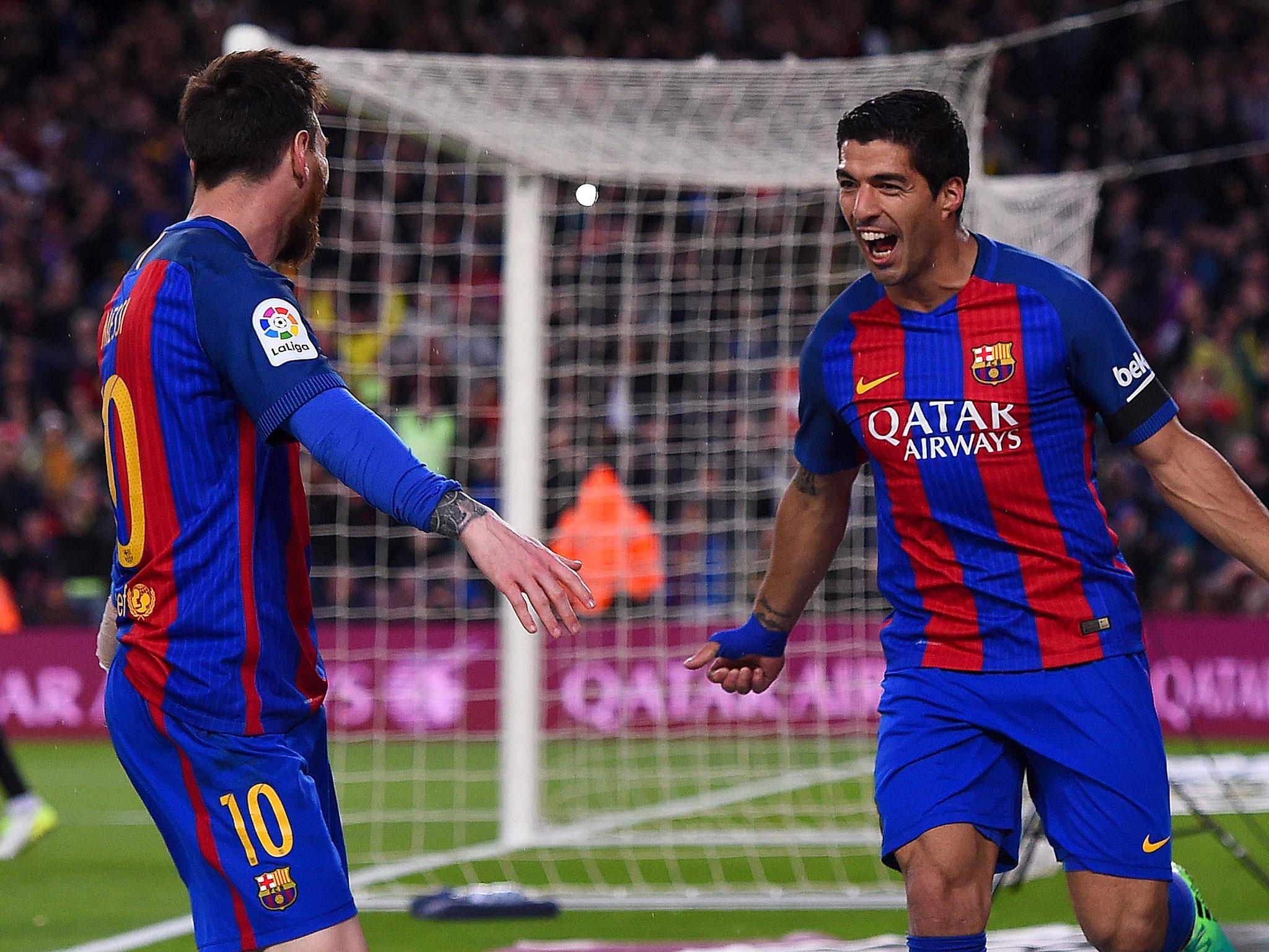 Messi scored twice and Suarez added another as Barcelona kept the pressure on the title race
