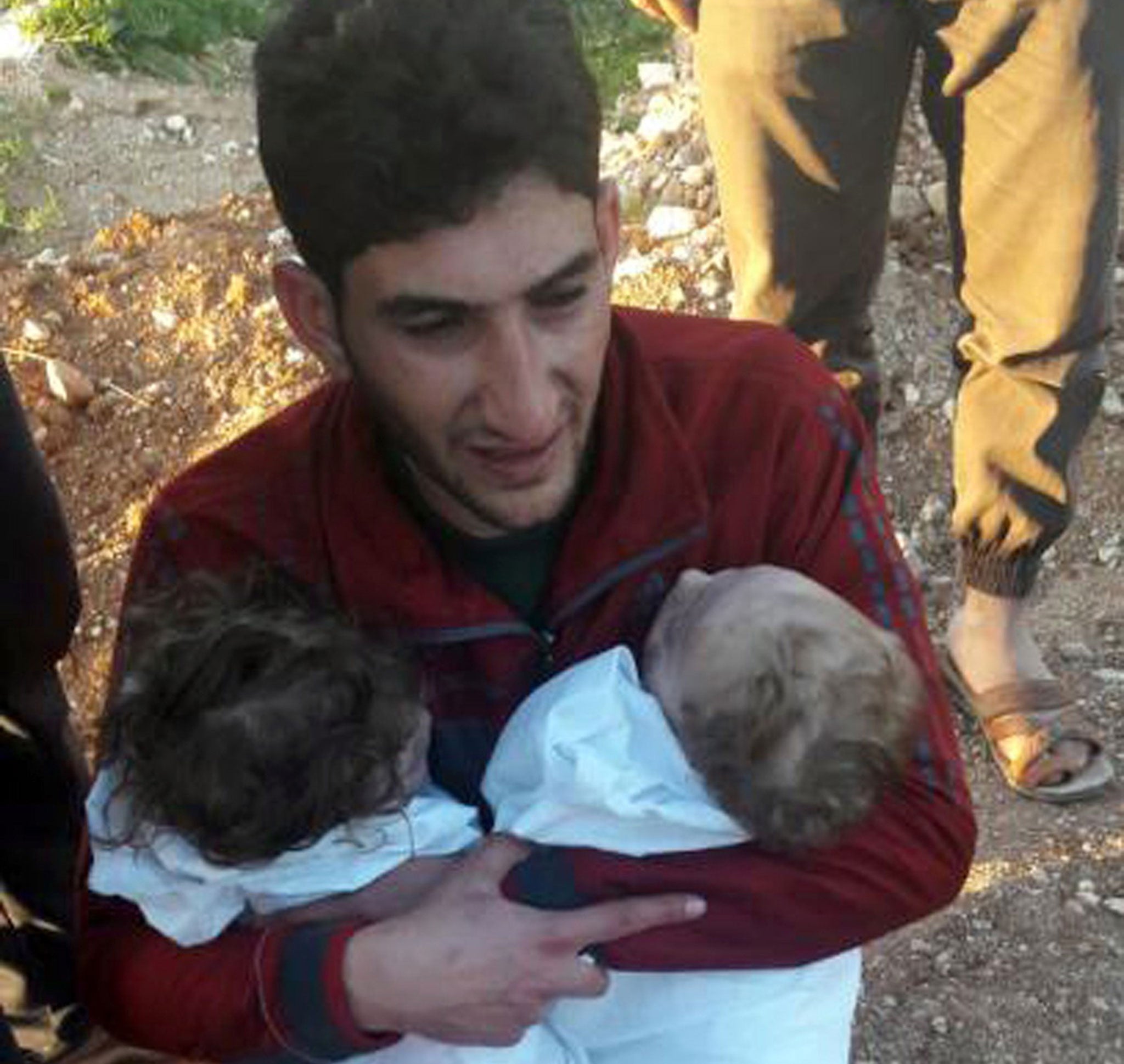 Abdul-Hamid Alyousef, 29, cries as he holds his twin babies who were killed during a suspected chemical weapons attack, in Khan Sheikhoun town, in the northern province of Idlib, Syria