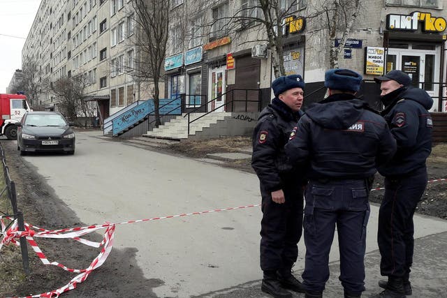 Russian police officers secure a residential area in St Petersburg