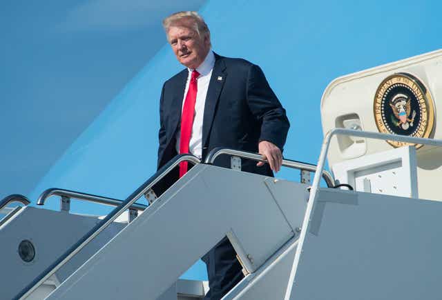 President Trump arrives at Palm Beach International Airport in Florida to spend the weekend at his Mar-a-Lago resort